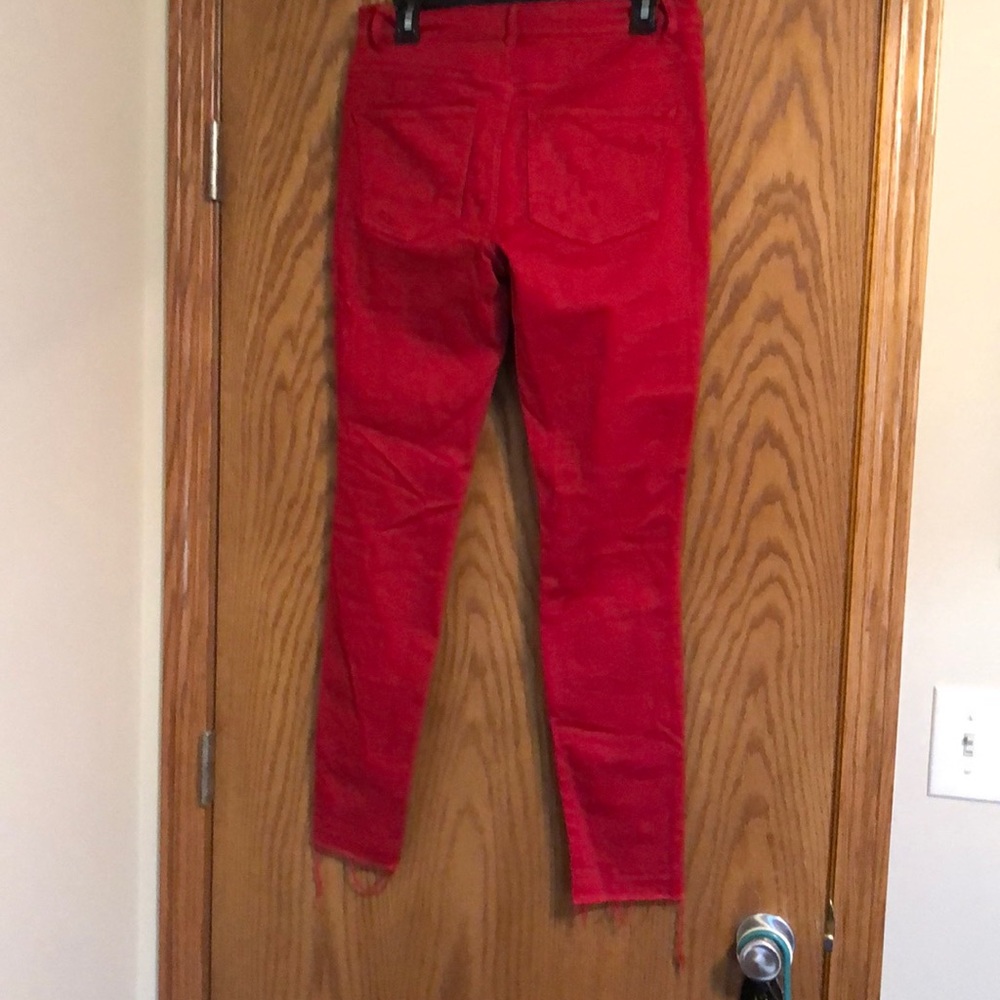 Red ripped jeans